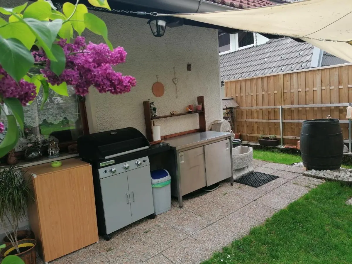 Outdoor kitchen with barbecue in the garden