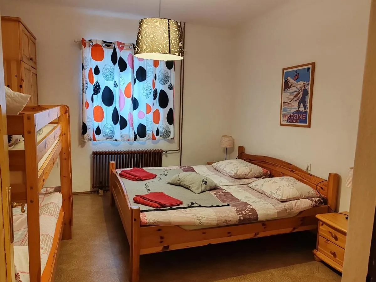Bedroom with a double bed and a bunk bed