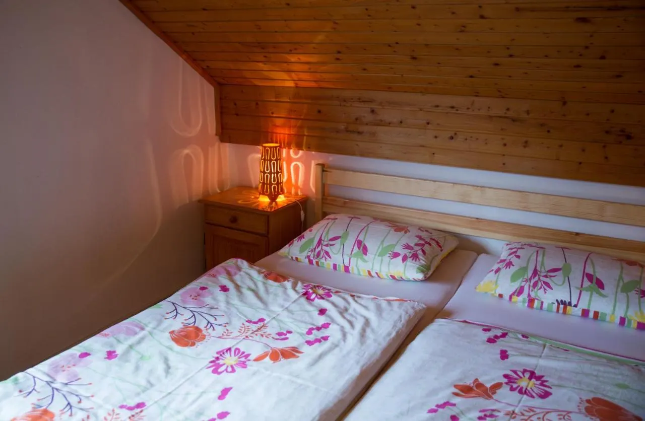 The bed under the wooden ceiling